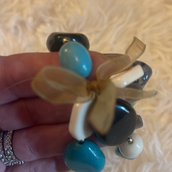 Cute turquoise, black and white bracelet with gold bow tie to hold the together. - Picture 3 of 3